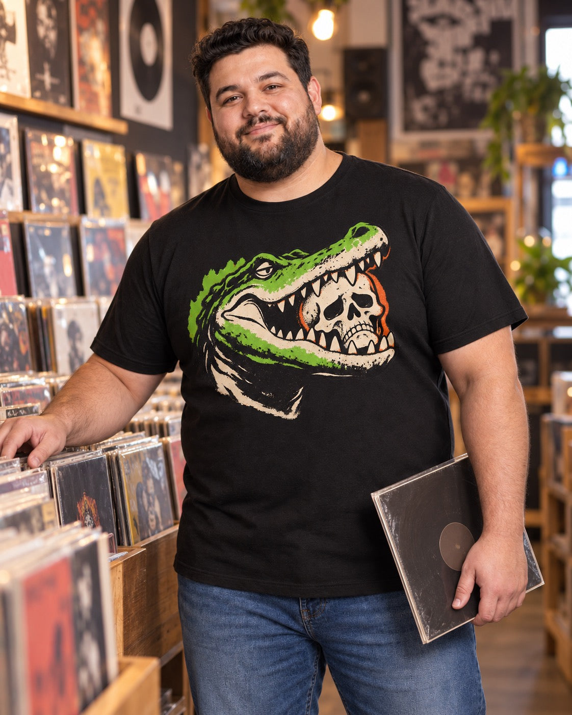 Man wearing men's black gator skull t-shirt in vinyl record shop