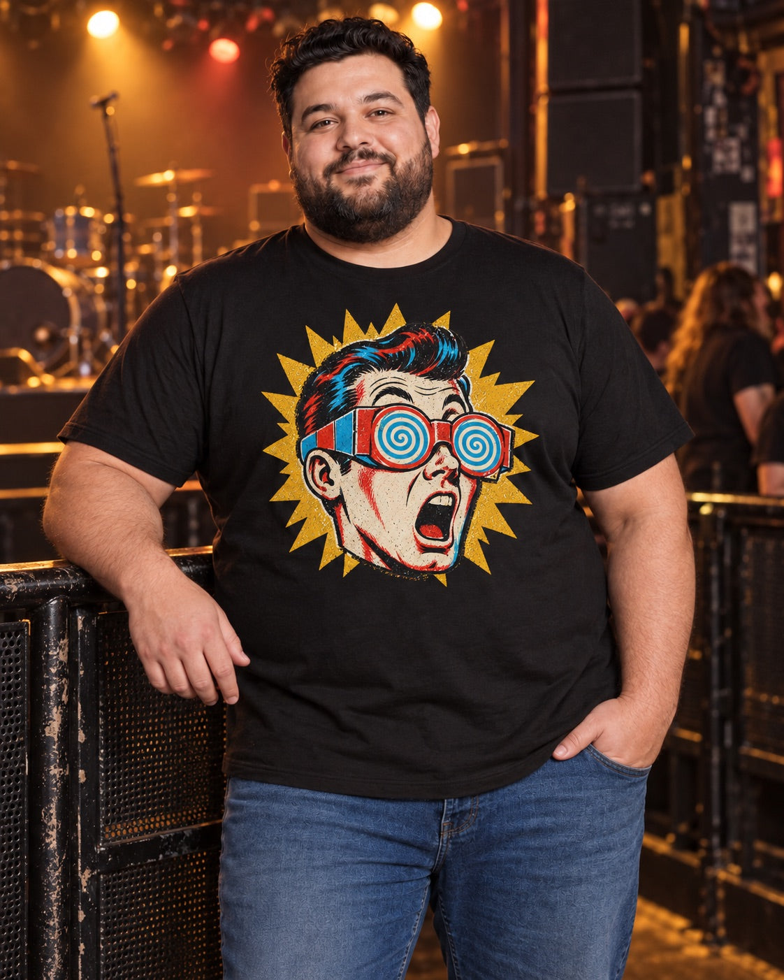 Man wearing men's black shocked pop-art guy t-shirt at live concert stage